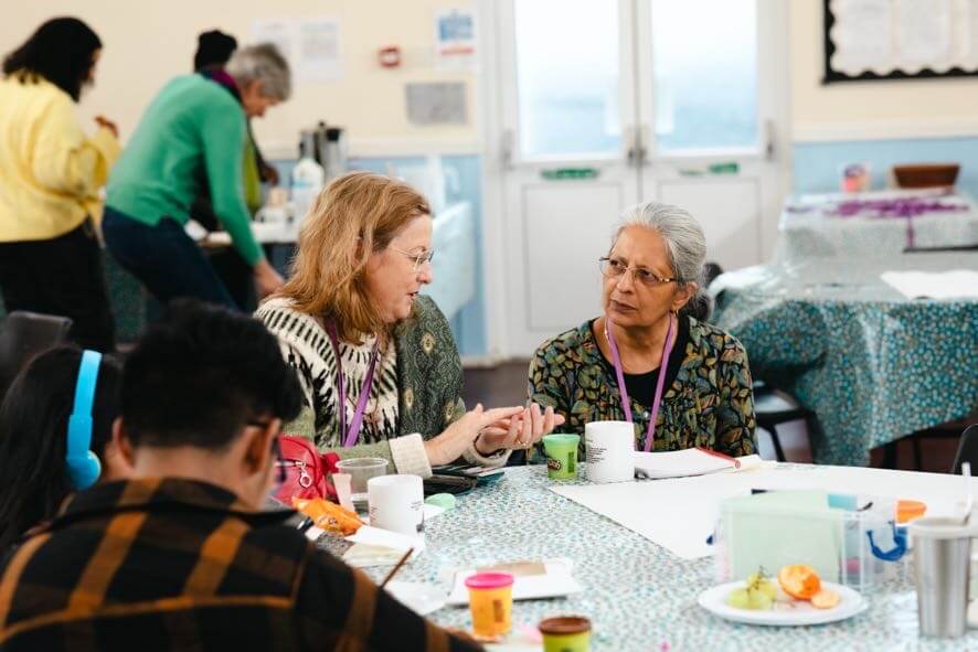 People learning together at a community event